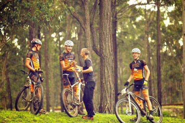 Dean Clark congratulates the riders after a tough stage at Port to Port