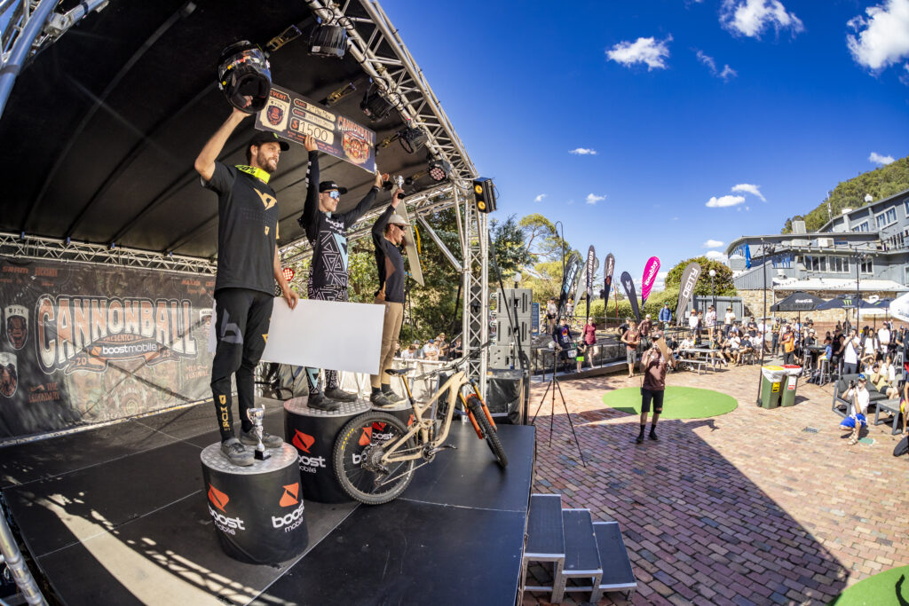 Luke Meier-Smith on top of the elite men's podium for the Fox Flow Motion Cup at 2025 Cannonball Festival